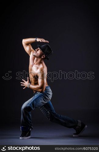 Dancer dancing in the dark studio
