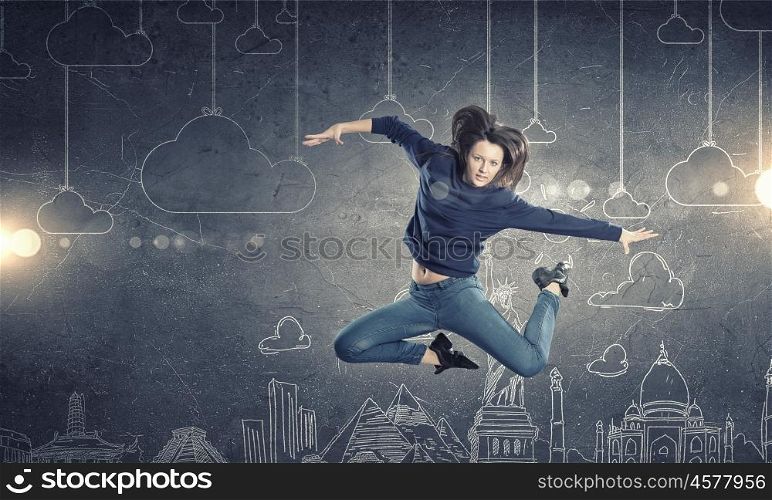 Dancer girl in jump. Young woman dancer jumping in spotlights on sketched background