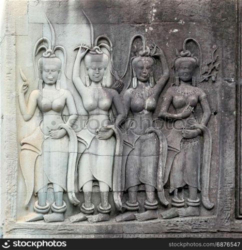 Dancing Apsaras bas relief in Angkor Wat, Siem Reap, Cambodia, Asia