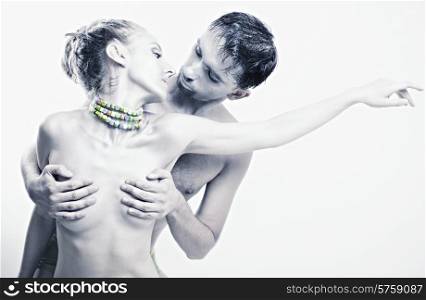 Dancing naked man and woman on a white background