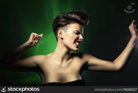 dancing woman with red lips in green light
