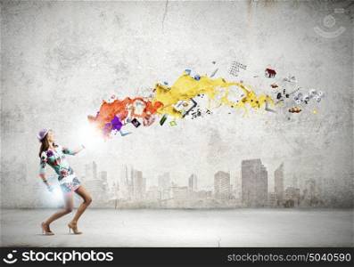 Dancing woman. Young dancing woman in colored dress and hat