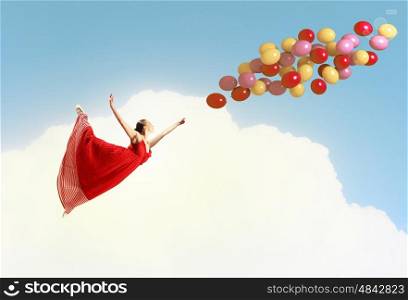 Dancing woman. Young woman in dress and ballerinas dancing with colorful balloons
