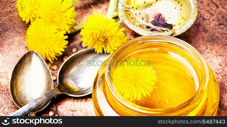Dandelion honey and flowers dandelion. Honey from blossoming spring dandelions, as a medicine