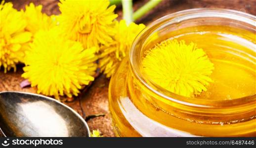 Dandelion honey in jar. Honey from blossoming spring dandelions, as a medicine.Dandelion jam