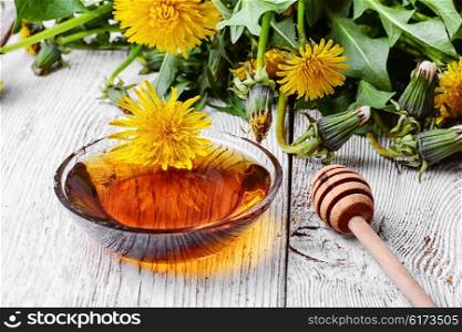 Dandelion honey. Saucer therapeutic honey made from dandelions in national recipe