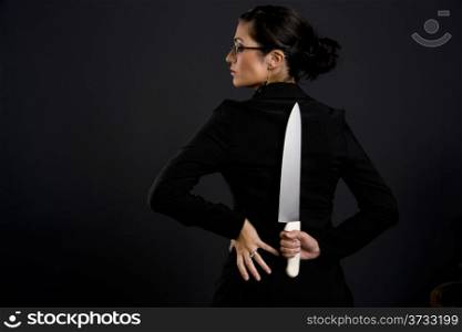 Danger Woman in Black Waiting to Attack Hiding Large Knife
