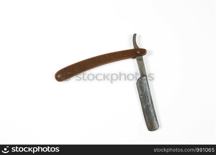 dangerous vintage shaving blade on white isolated background