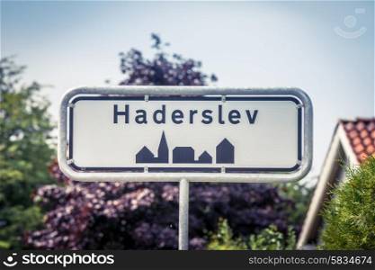 Danish city sign of Haderslev in the summer