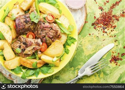 Danish meat baked with new potatoes.Roasted meat. Grilled meat and potatoes