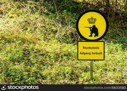 Danish shooting range warning sign in nature