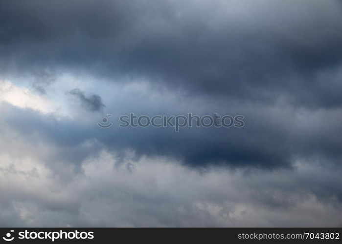 Dark and grey clouds are in the sky