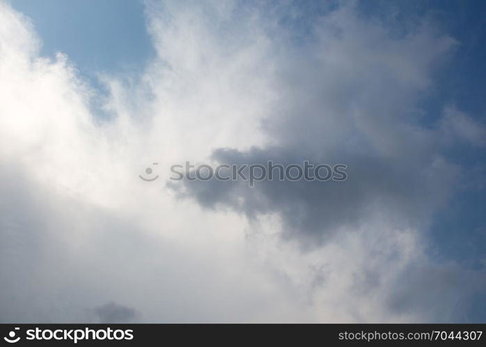 Dark and grey clouds are in the sky