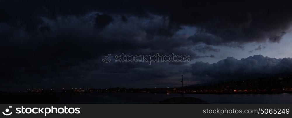 Dark and rainy clouds above the island