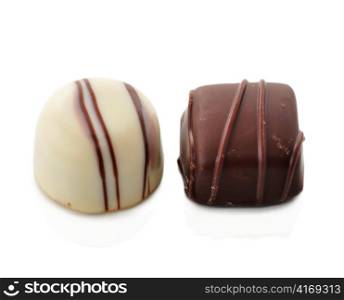 dark and white chocolate candies on white background