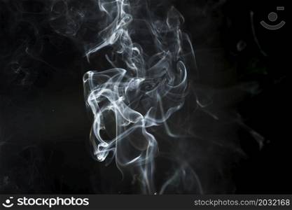 dark background with delicate white smoke