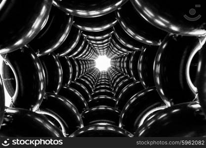 dark black and white curved pipes background