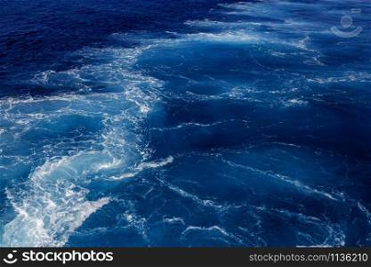 Dark blue sea water surface with azure ripple can use as background