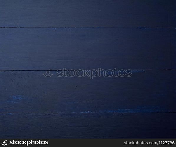 Dark blue wooden texture background. Wooden table.