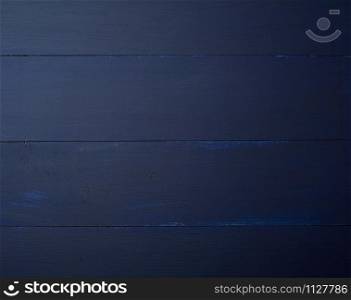 Dark blue wooden texture background. Wooden table.