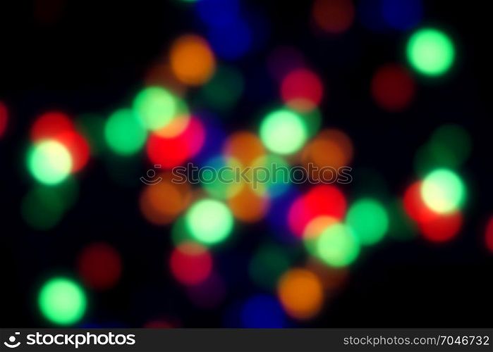 Dark blurred background with yellow, orange and red spots