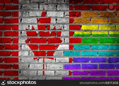 Dark brick wall texture - coutry flag and rainbow flag painted on wall - Canada