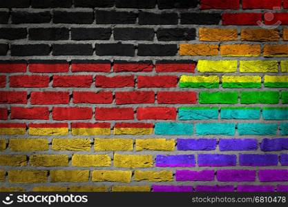 Dark brick wall texture - coutry flag and rainbow flag painted on wall - Germany