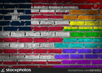 Dark brick wall texture - coutry flag and rainbow flag painted on wall - Liberia