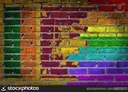 Dark brick wall texture - coutry flag and rainbow flag painted on wall - Sri Lanka