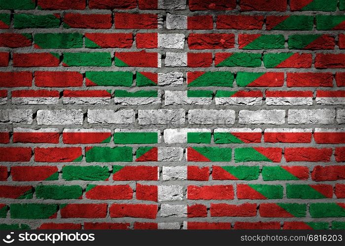 Dark brick wall texture - flag painted on wall - Basque Country
