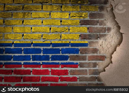 Dark brick wall texture with plaster - flag painted on wall - Colombia