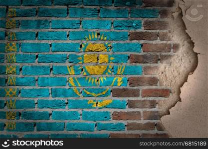 Dark brick wall texture with plaster - flag painted on wall - Kazakhstan