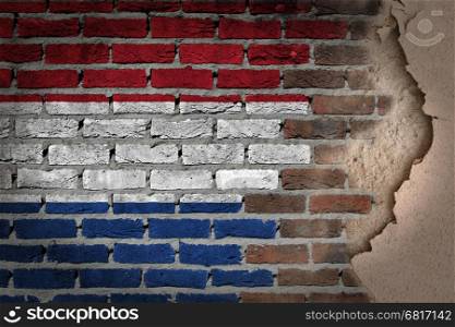 Dark brick wall texture with plaster - flag painted on wall - Netherlands