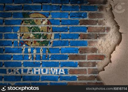 Dark brick wall texture with plaster - flag painted on wall - Oklahoma