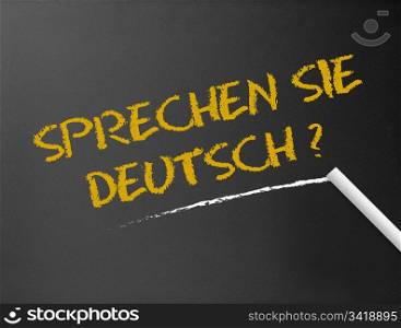 Dark chalkboard with a question: Sprechen Sie Deutsch?