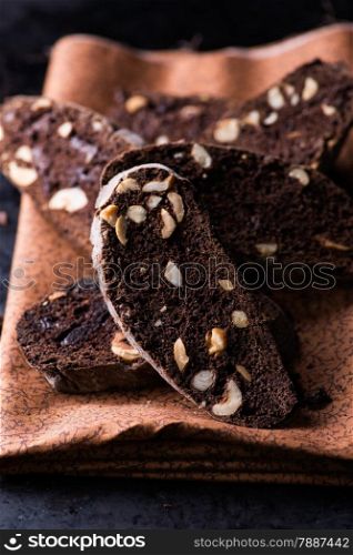 Dark chocolate biscotti with nuts, selective focus