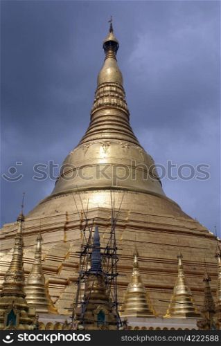 Dark clouds and Shwedagon Paya pagoda in Yangon, Myanmar