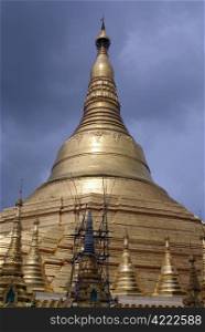 Dark clouds and Shwedagon Paya pagoda in Yangon, Myanmar