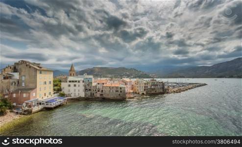 Dark clouds and sunshine over Saint Florent in northern Corsica