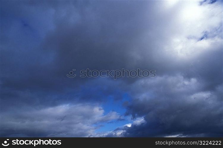 Dark Clouds Filling The Blue Sky