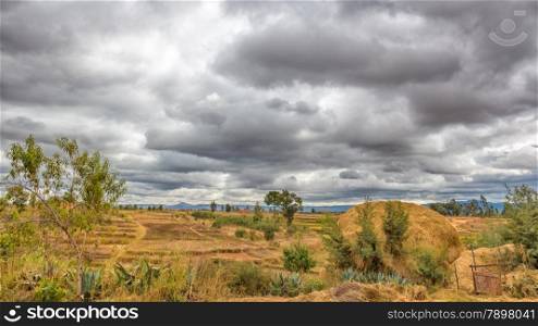 Dark clouds hovering over the farm lands of the highland areas of Madagascar