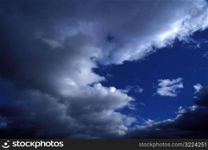 Dark Clouds In A Blue Sky
