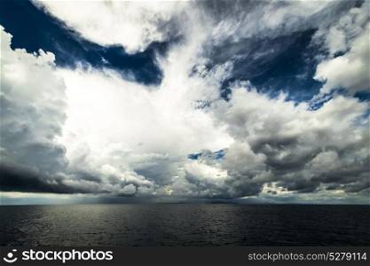 Dark clouds in open ocean. Dark clouds in open ocean. Tropical hurricane and sea storm. Dark clouds in open ocean