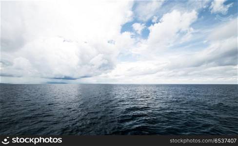 Dark clouds in open ocean. Dark clouds in open ocean. Tropical hurricane and sea storm. Dark clouds in open ocean