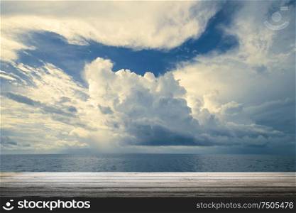 Dark clouds in open ocean. Tropical hurricane and sea storm. Dark clouds in open ocean