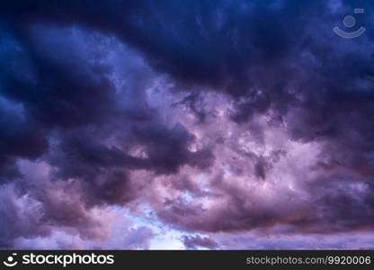 Dark clouds in the sky before thunderstorm. The clouds flow rapidly in the sky.