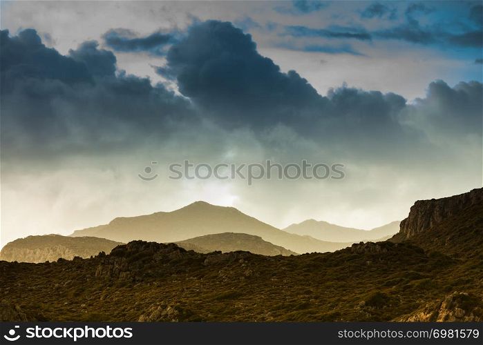 Dark clouds moody, after storm and foggy view on hills and mountains. Alternative Greece landscapes.. Dark cloudy sky and hills