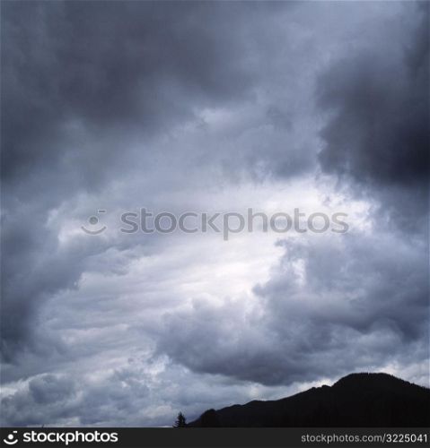 Dark Clouds Over A Black Mountain