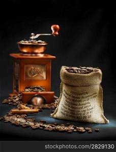 dark composition of coffee mill and bag