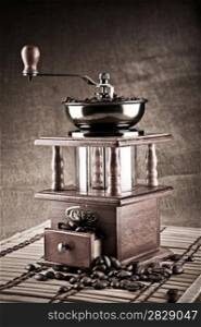 dark composition of coffee mill and coffee beans